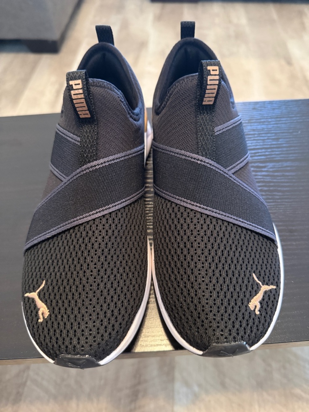Puma women’s Black Slip-On Athletic Sneakers with Gold Accents - Picture 2 of 3